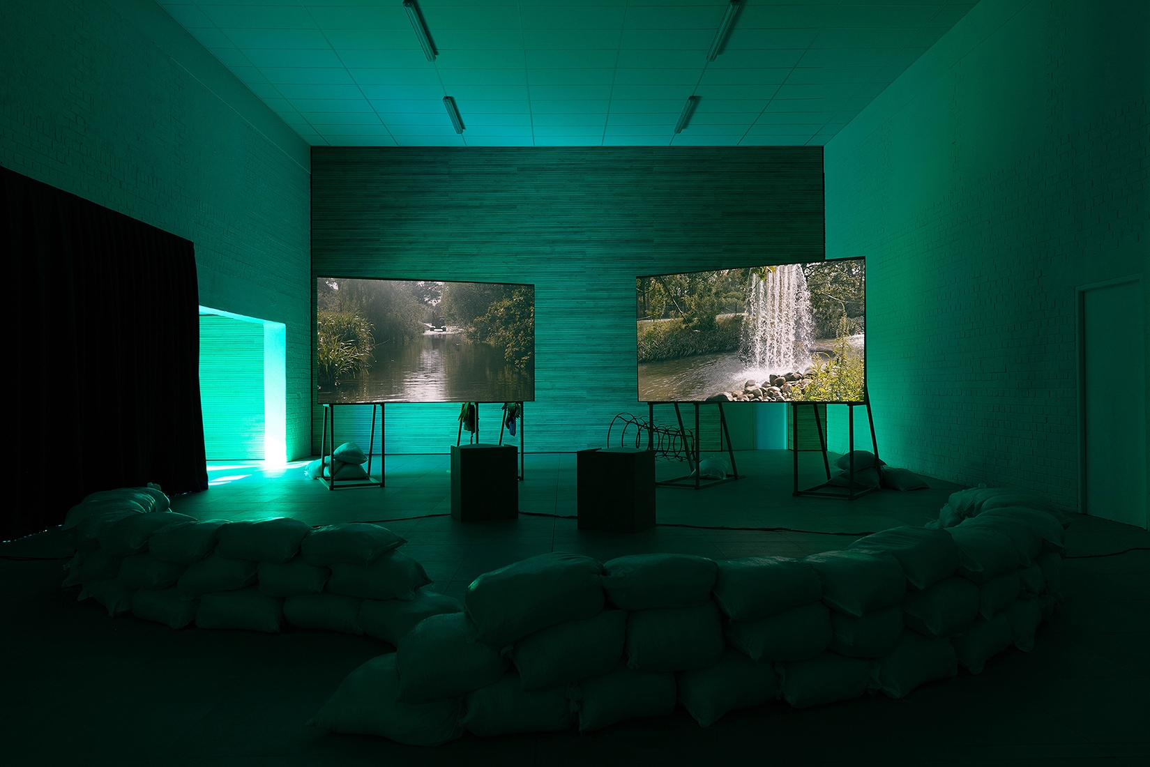 https://www.abrideswardt.com/files/gimgs/th-81_Installation view Abri de Swardt, Kammakamma (2022-2024), Synchronised two-channel projection, configurable screens, sand from Macassar Dunes, and costumes, 16’54 min 3.jpg